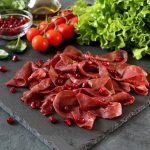 Sliced Prosciutto With Pomegranate Seeds